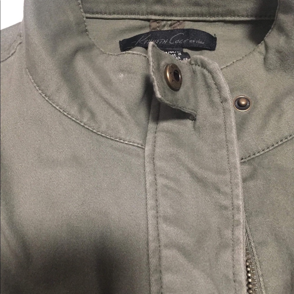 Green jacket with black sleeves